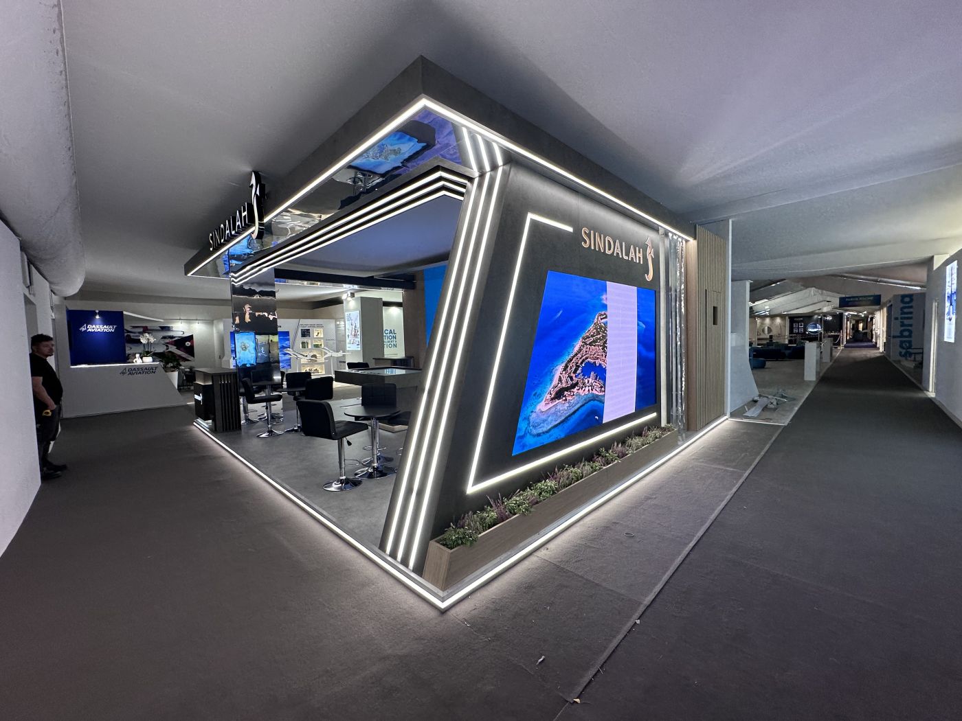 Sindalah premium brand environment with illuminated geometric facade
